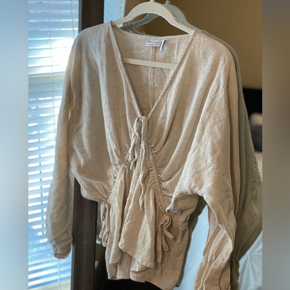 ASOS natural crinkle top with side ties in the color oatmeal.